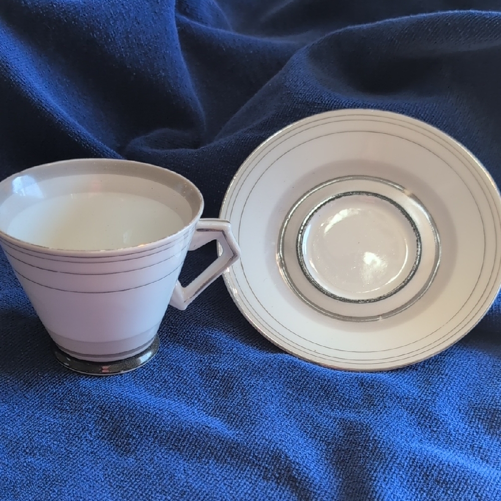 Elegant White and Silver Tea Cup and Saucer Set